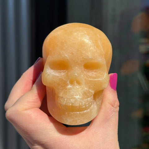 Ravenstone Crystals Orange Calcite Skull "Tyra"
